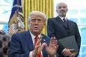 President Donald Trump speaks as he signs executive orders in the Oval Office of the White House, T…