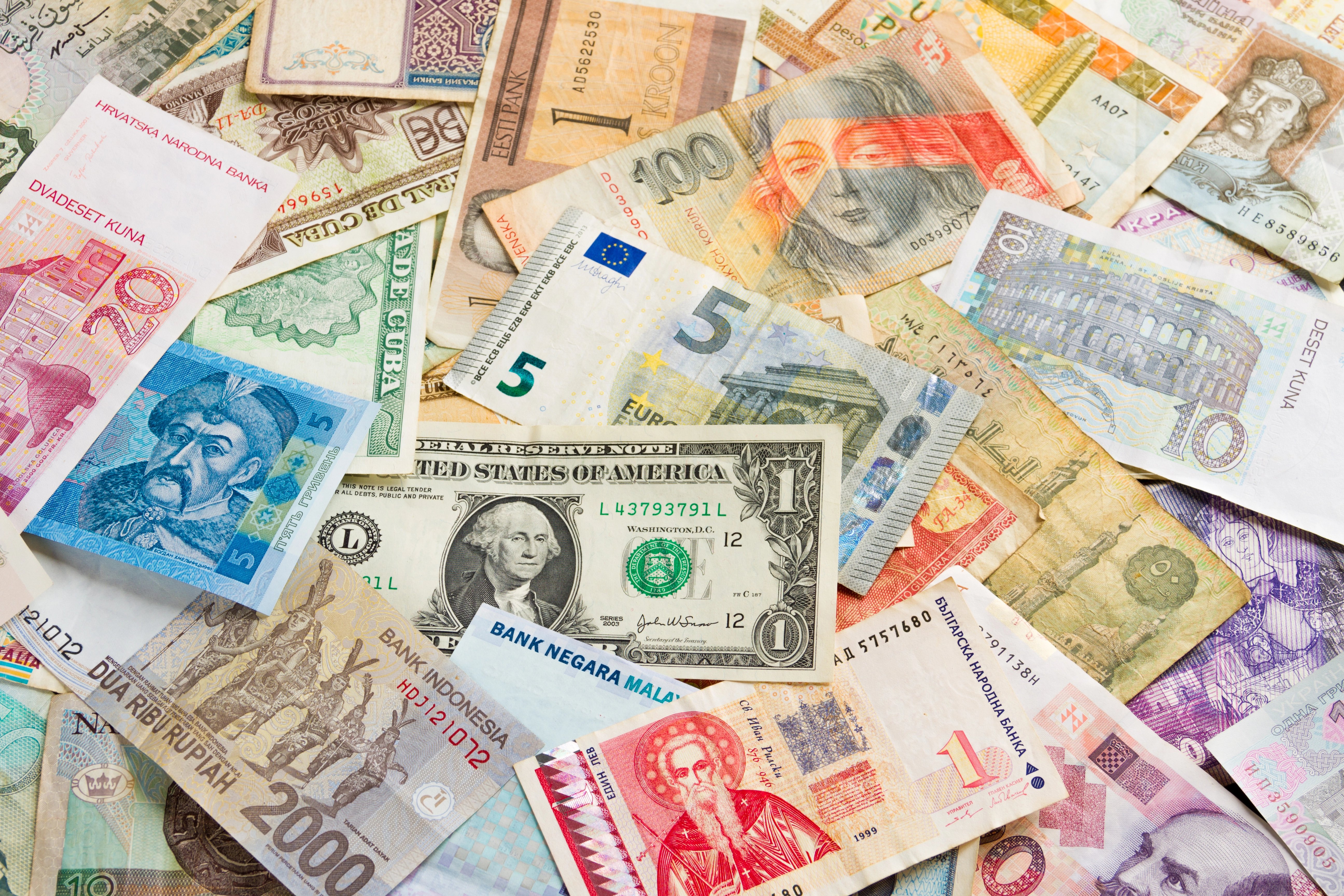 foreign currency bills with USD in the middle